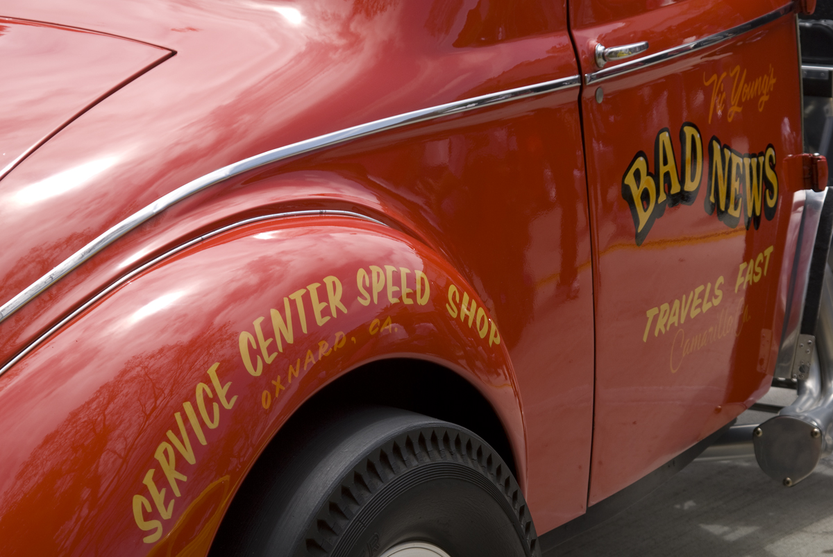 Vintage Car | Good Life News A vintage car with 'Bad News' lettering is displayed at the Service Center Speed Shop in Oxnard, California, illustrating.